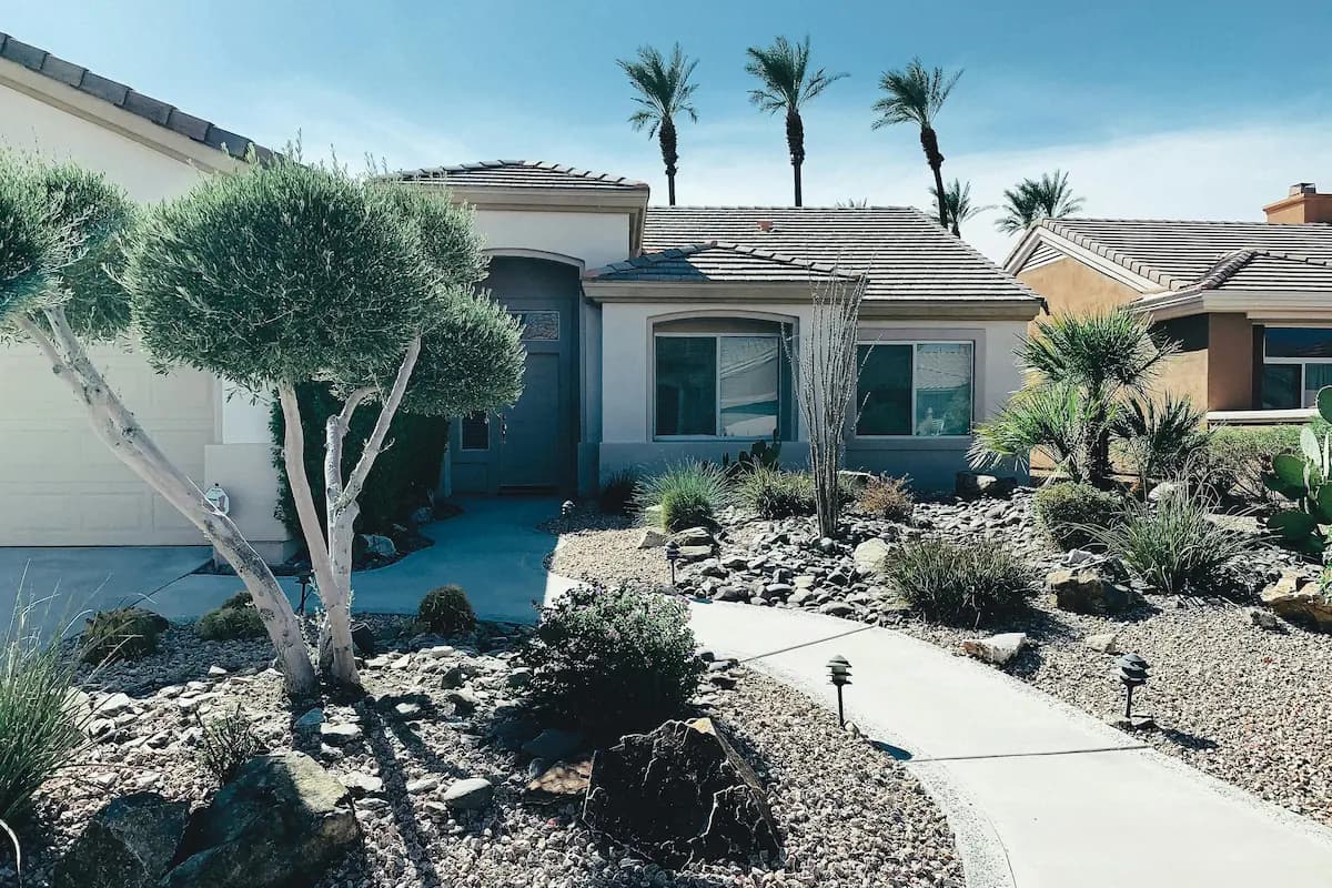 Modern home landscaping with stone and greenery